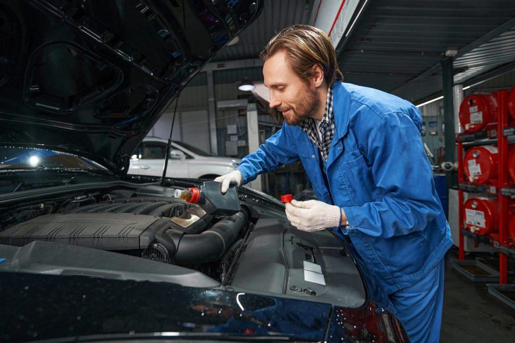 car-mechanic-performing-car-maintenance-at-service-station.jpg